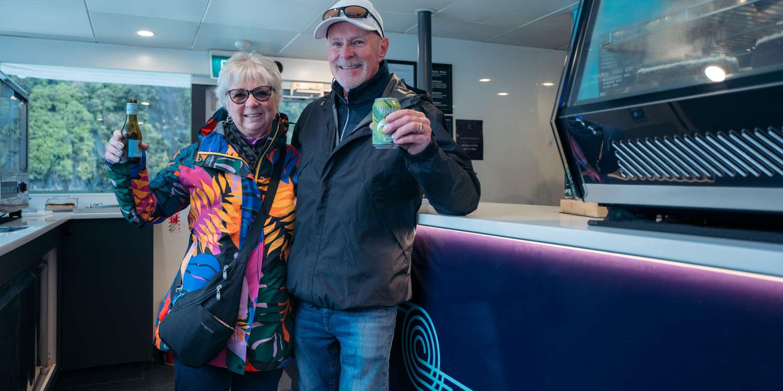 Rainforest covered sheer cliffs reflecting in Milford Sound